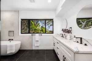 A modern Hollywood Hills home bathroom in Los Angeles, California, with a remodel of an older house